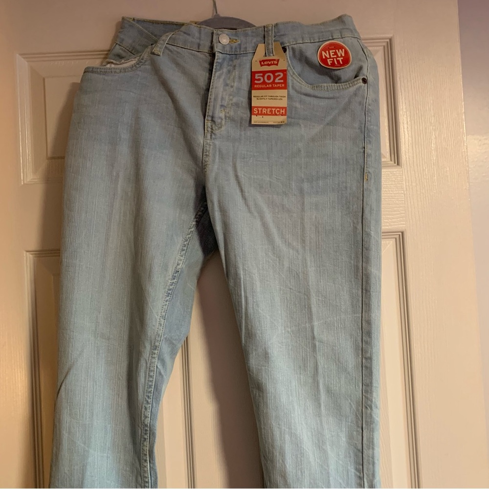 Levi’s women’s 502 jeans 
Regular taper stretch 
Light blue wash not dark blue